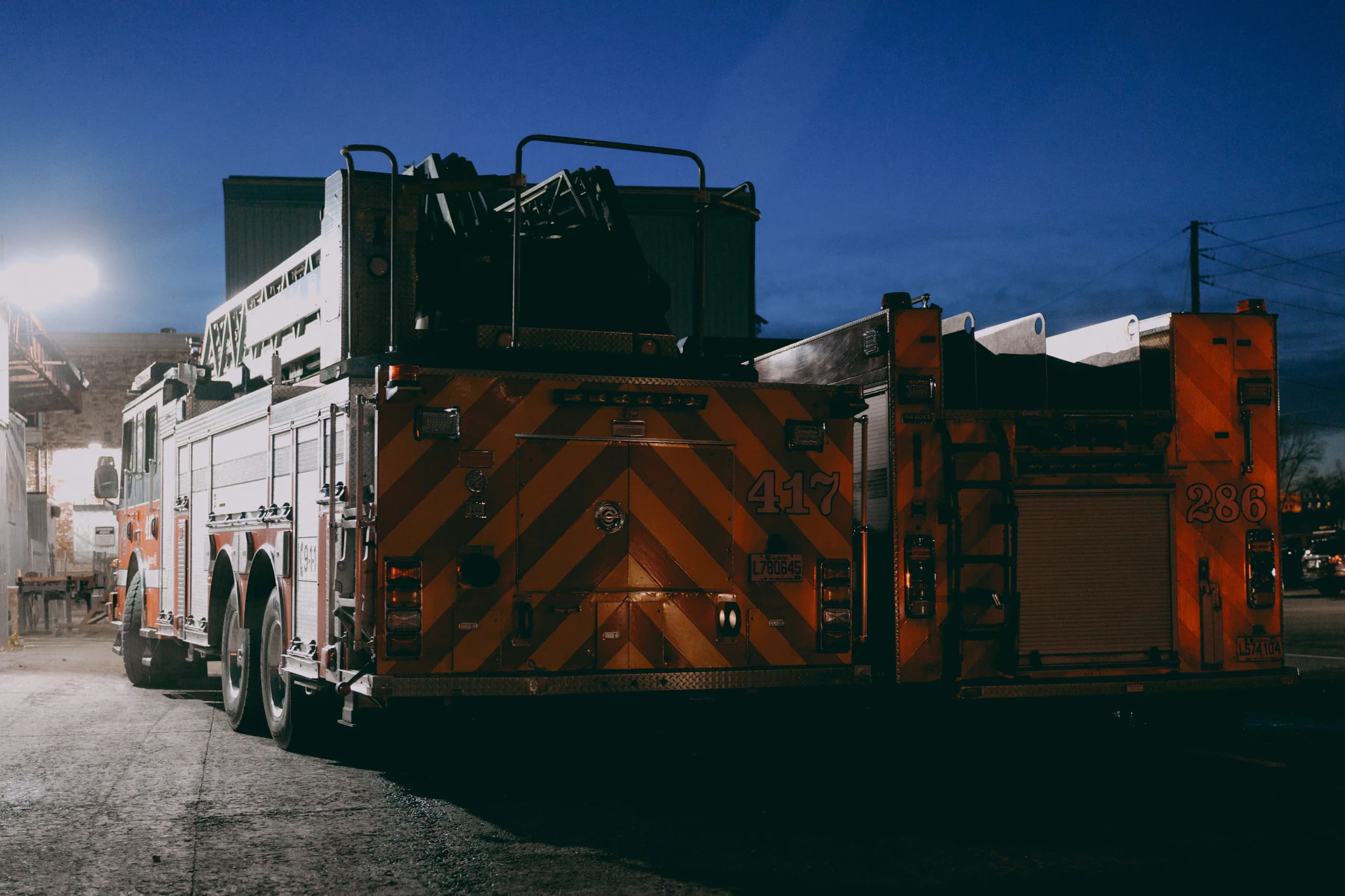 Two Pineland engines parked outside the station at dusk
